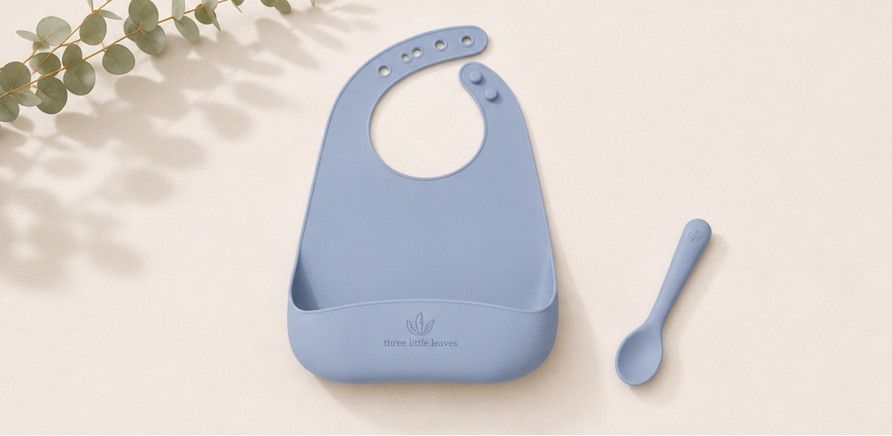 Silicon baby bib and spoon set in blue colour. Suitable for weening babies.